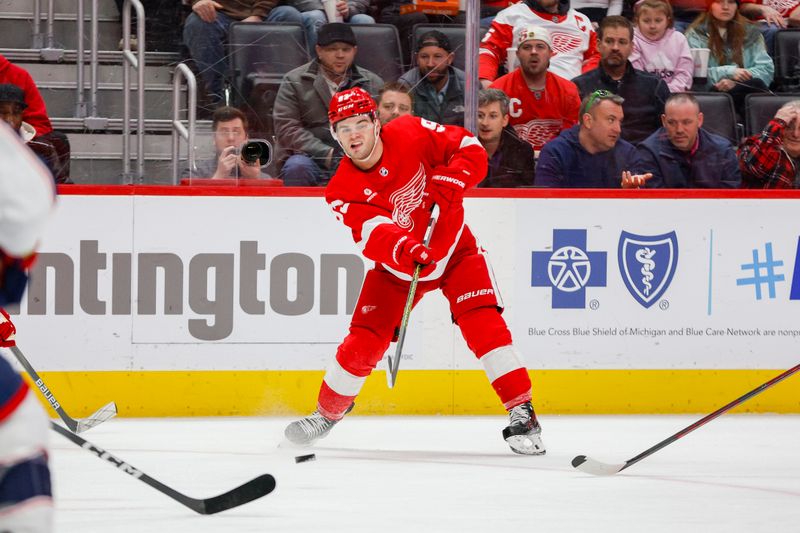 Mar 19, 2024; Detroit, Michigan, USA; Detroit Red Wings right wing Alex DeBrincat (93) passes the puck during the third period of the game against the Columbus Blue Jackets at Little Caesars Arena. Mandatory Credit: Brian Bradshaw Sevald-USA TODAY Sports