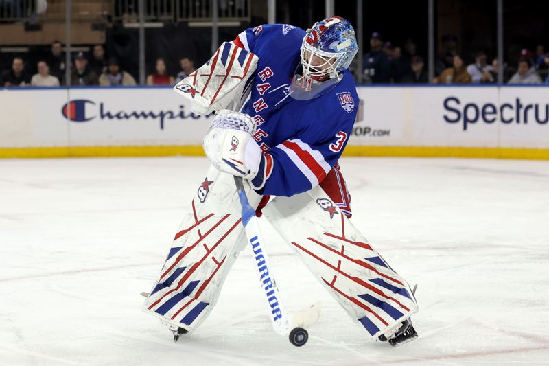 Dec 15, 2025; New York, New York, USA; New York Rangers goaltender Igor Shesterkin (31) plays the puck against the Anaheim Ducks during the second period at Madison Square Garden. Mandatory Credit: Brad Penner-Imagn Images