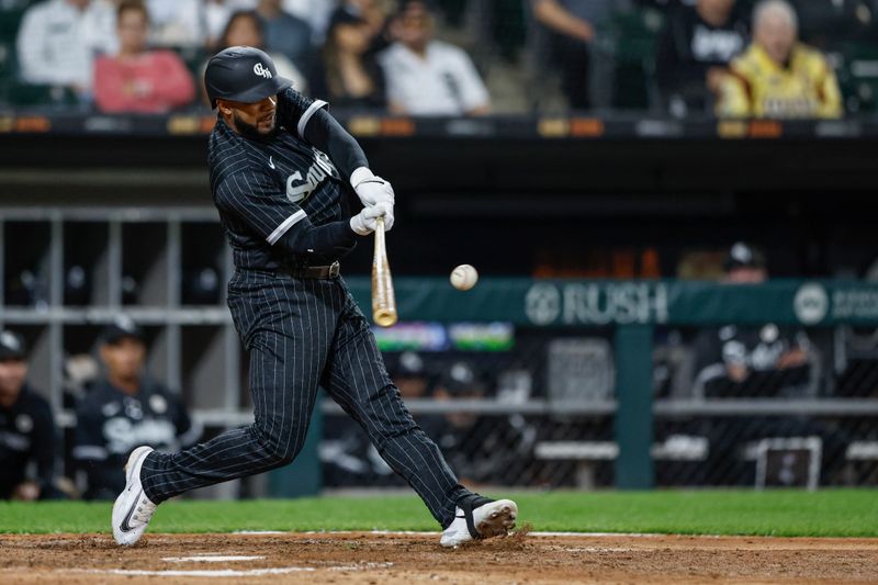 Sep 15, 2023; Chicago, Illinois, USA; Chicago White Sox shortstop Elvis Andrus (21) hits a two-run home run against the Minnesota Twins during the fifth inning at Guaranteed Rate Field. Mandatory Credit: Kamil Krzaczynski-USA TODAY Sports