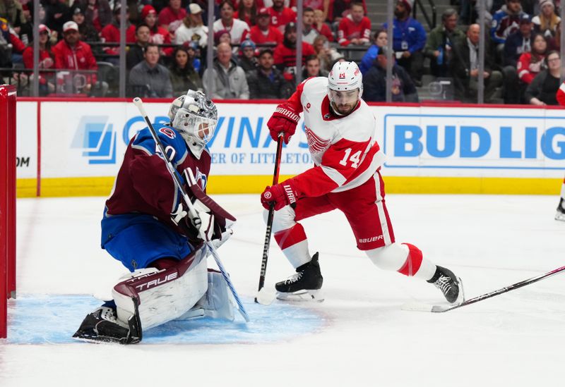 Mar 6, 2024; Denver, Colorado, USA; Detroit Red Wings center Robby Fabbri (14) shoots and scores on Colorado Avalanche goaltender Alexandar Georgiev (40) in the first period at Ball Arena. Mandatory Credit: Ron Chenoy-USA TODAY Sports