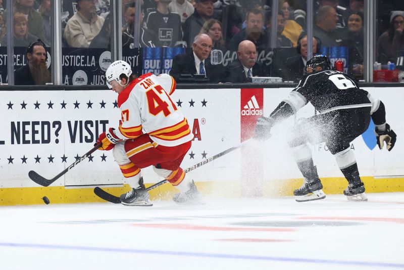 Dec 23, 2023; Los Angeles, California, USA; Calgary Flames center Connor Zary (47) skates for the puck against /LAK6/ during the second period of a game at Crypto.com Arena. Mandatory Credit: Jessica Alcheh-USA TODAY Sports