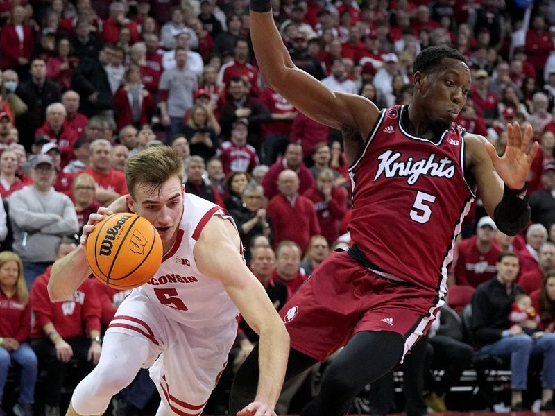 Feb. 18, 2023; Madison, WI, USA; Wisconsin Badgers forward Tyler Wahl (5) is fouled by Rutgers Scarlet Knights forward Aundre Hyatt (5) during the second half at the Kohl Center. Rutgers beat Wisconsin 58-57. Mandatory Credit: Mark Hoffman-USA TODAY Sports