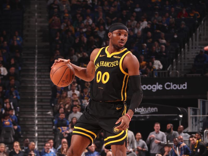 SAN FRANCISCO, CA - JANUARY 10: Jonathan Kuminga #00 of the Golden State Warriors dribbles the ball during the game against the New Orleans Pelicans on January 10, 2024 at Chase Center in San Francisco, California. NOTE TO USER: User expressly acknowledges and agrees that, by downloading and or using this photograph, user is consenting to the terms and conditions of Getty Images License Agreement. Mandatory Copyright Notice: Copyright 2024 NBAE (Photo by Jed Jacobsohn/NBAE via Getty Images)