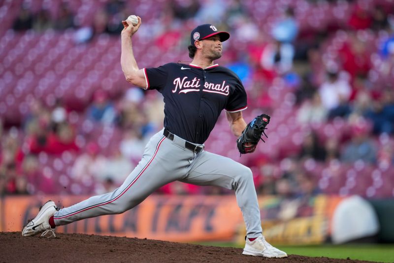 May 4, 2025; Cincinnati, Ohio, USA;  Washington Nationals pitcher Kyle Finnegan (67) throws against the Cincinnati Reds in the ninth inning inning at Great American Ball Park. Mandatory Credit: Aaron Doster-Imagn Images