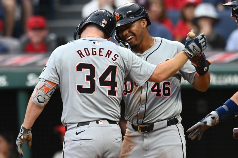 Jul 22, 2024; Cleveland, Ohio, USA; Detroit Tigers catcher Jake Rogers (34) celebrates with right fielder Wenceel Perez (46) after scoring on a triple and a throwing error by Cleveland Guardians center fielder Angel Martinez (not pictured) during the second inning at Progressive Field. Mandatory Credit: Ken Blaze-USA TODAY Sports