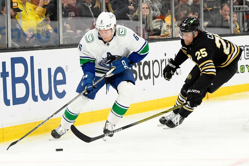 Feb 8, 2024; Boston, Massachusetts, USA; Vancouver Canucks right wing Brock Boeser (6) controls the puck from Boston Bruins defenseman Brandon Carlo (25) during the second period at TD Garden. Mandatory Credit: Bob DeChiara-USA TODAY Sports