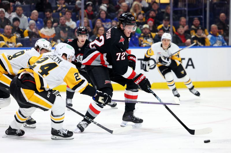 Jan 17, 2025; Buffalo, New York, USA;  Buffalo Sabres center Tage Thompson (72) makes a pass as Pittsburgh Penguins defenseman Matt Grzelcyk (24) defends during the second period at KeyBank Center. Mandatory Credit: Timothy T. Ludwig-Imagn Images