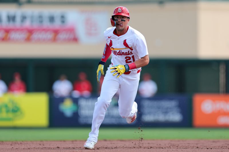 Mar 15, 2025; Jupiter, Florida, USA; St. Louis Cardinals right fielder Lars Nootbaar (21) runs toward third base against the Toronto Blue Jays during the first inning at Roger Dean Chevrolet Stadium. Mandatory Credit: Sam Navarro-Imagn Images