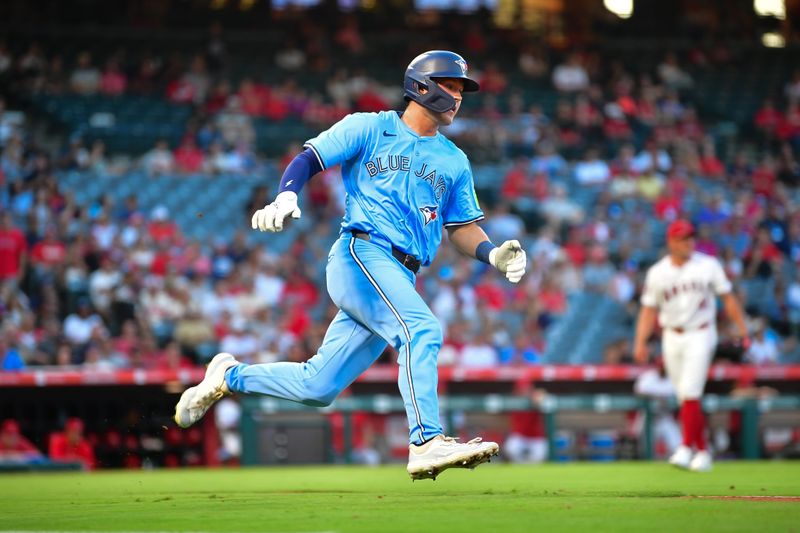 Aug 13, 2024; Anaheim, California, USA; Toronto Blue Jays second baseman Will Wagner (7) runs after hitting a double against the Los Angeles Angels during the third inning at Angel Stadium. Mandatory Credit: Gary A. Vasquez-USA TODAY Sports