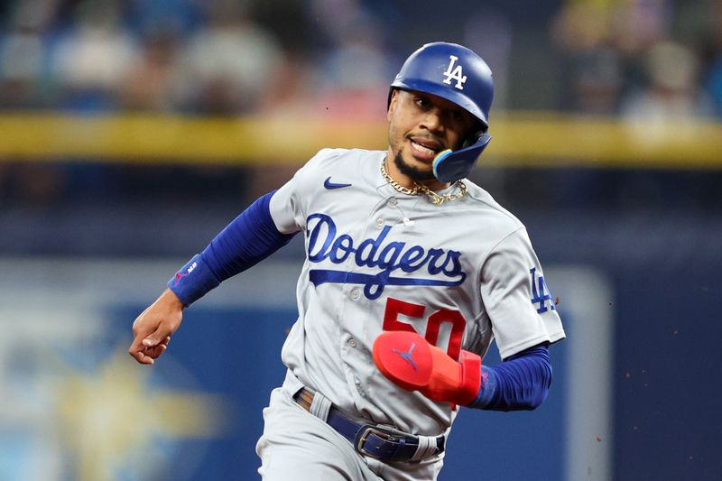 May 26, 2023; St. Petersburg, Florida, USA;  Los Angeles Dodgers right fielder Mookie Betts (50) runs the bases against the Tampa Bay Rays in the first inning at Tropicana Field. Mandatory Credit: Nathan Ray Seebeck-USA TODAY Sports