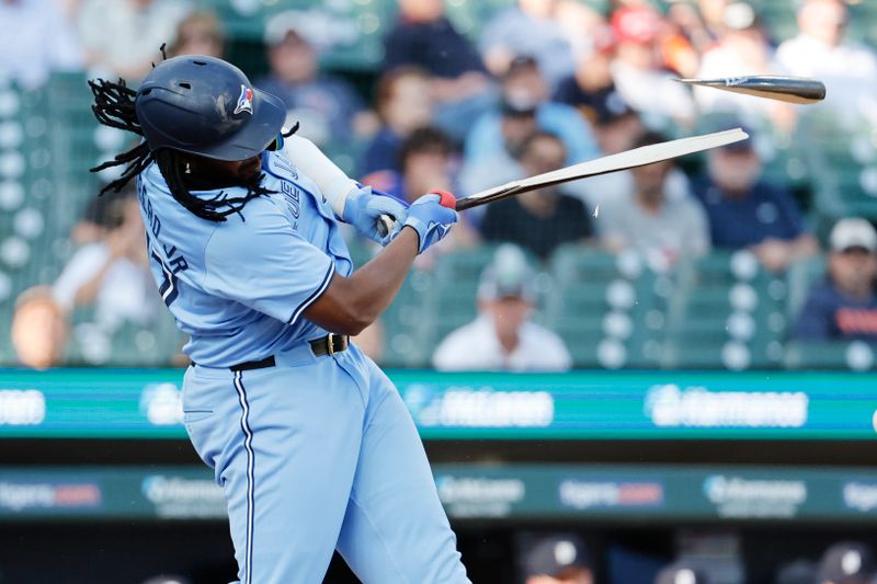 May 23, 2024; Detroit, Michigan, USA;  Toronto Blue Jays first baseman Vladimir Guerrero Jr. (27) breaks his bat grounding out in the first inning against the Detroit Tigers at Comerica Park. Mandatory Credit: Rick Osentoski-USA TODAY Sports