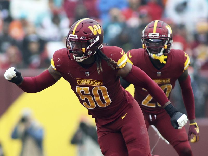 Washington Commanders defensive end Andre Jones Jr. (50) runs during an NFL football game the against Miami Dolphins, Sunday, December 03, 2023 in Landover, Md. (AP Photo/Daniel Kucin Jr.)