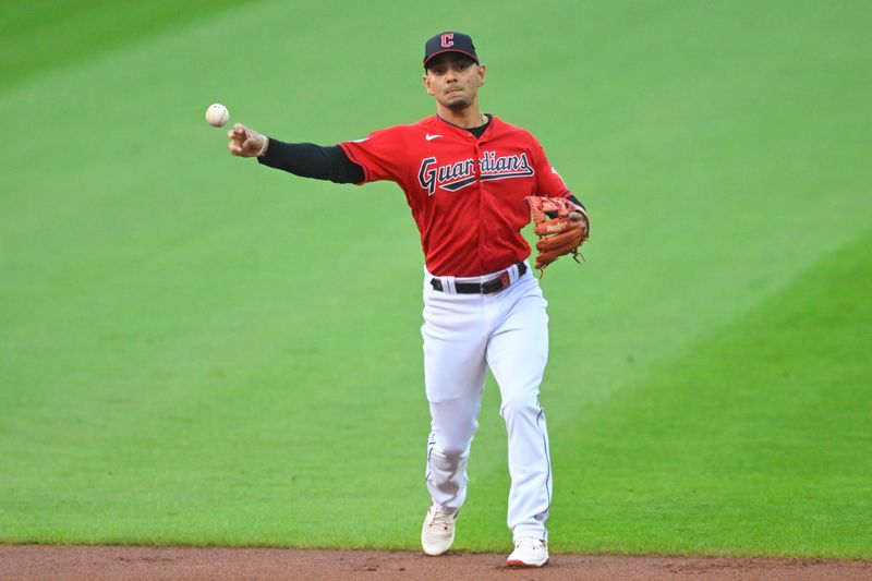 Aug 8, 2023; Cleveland, Ohio, USA; Cleveland Guardians second baseman Andres Gimenez (0) throws to first base in the first inning against the Toronto Blue Jays at Progressive Field. Mandatory Credit: David Richard-USA TODAY Sports