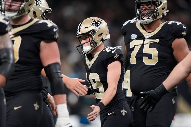 New Orleans Saints place-kicker Blake Grupe (19) is congratulated by teammates after making a field goal during the first half of an NFL football game against the Carolina Panthers, Sunday, Sept. 8, 2024, in New Orleans. (AP Photo/Gerald Herbert)