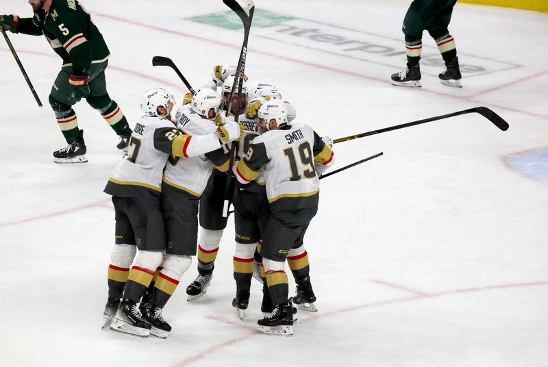 Apr 26, 2025; Saint Paul, Minnesota, USA; Vegas Golden Knights center Ivan Barbashev (49) celebrates with teammates after he puts the puck past Minnesota Wild goaltender Filip Gustavsson (32) during 1st OT in game four of the first round of the 2025 Stanley Cup Playoffs at Xcel Energy Center. Vegas Golden Knights win 4-3. Mandatory Credit: Bruce Fedyck-Imagn Images
