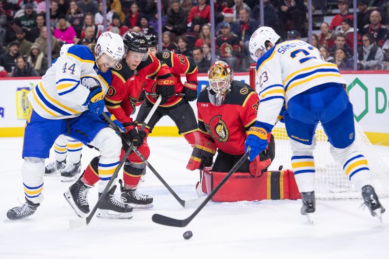 Dec 23, 2025; Ottawa, Ontario, CAN; Buffalo Sabres center Josh Dune (44) battles with Ottawa Senators left wing Fabian Zetterlund (20) as Sabres defenseman Mattias Samuelsson (23) settles the puck in the second period at the Canadian Tire Centre. Mandatory Credit: Marc DesRosiers-IMAGN Images