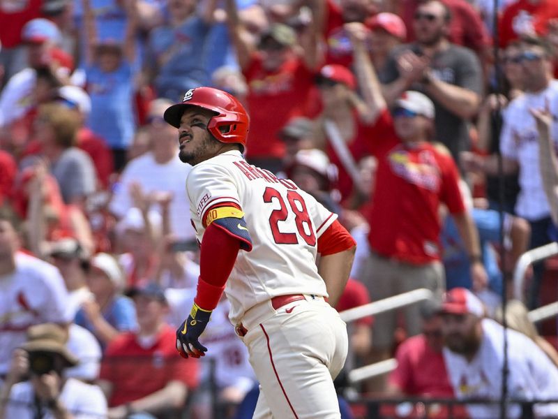 May 6, 2023; St. Louis, Missouri, USA;  St. Louis Cardinals third baseman Nolan Arenado (28) hits a two run home run against the Detroit Tigers during the fifth inning at Busch Stadium. Mandatory Credit: Jeff Curry-USA TODAY Sports