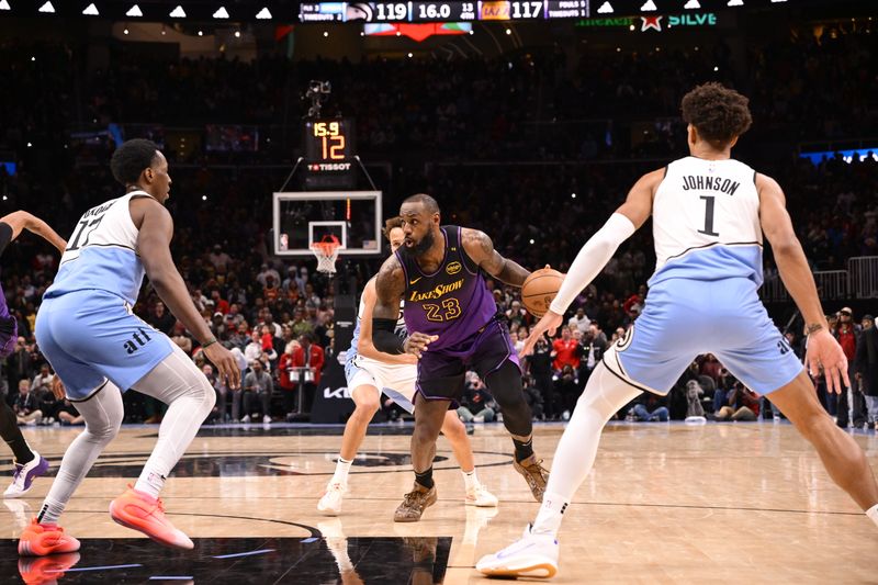 ATLANTA, GA - DECEMBER 6: LeBron James #23 of the Los Angeles Lakers handles the ball during the game against the Atlanta Hawks on December 6, 2024 at State Farm Arena in Atlanta, Georgia.  NOTE TO USER: User expressly acknowledges and agrees that, by downloading and/or using this Photograph, user is consenting to the terms and conditions of the Getty Images License Agreement. Mandatory Copyright Notice: Copyright 2024 NBAE (Photo by Adam Hagy/NBAE via Getty Images)