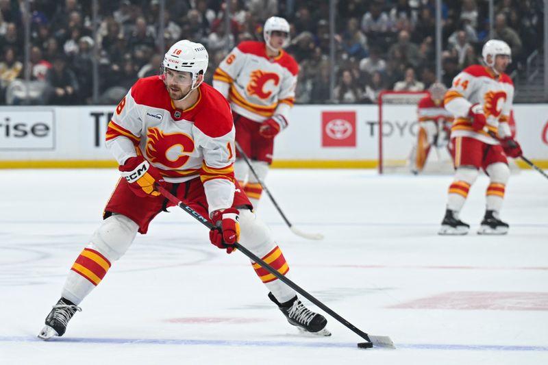 Feb 28, 2026; Los Angeles, California, USA; Calgary Flames center John Beecher (18) skates with the puck during the first period against the Los Angeles Kings at Crypto.com Arena. Mandatory Credit: Griffin Hooper-Imagn Images