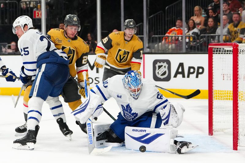 Jan 15, 2026; Las Vegas, Nevada, USA; Toronto Maple Leafs goaltender Joseph Woll (60) makes a save against the Vegas Golden Knights during the second period at T-Mobile Arena. Mandatory Credit: Stephen R. Sylvanie-Imagn Images