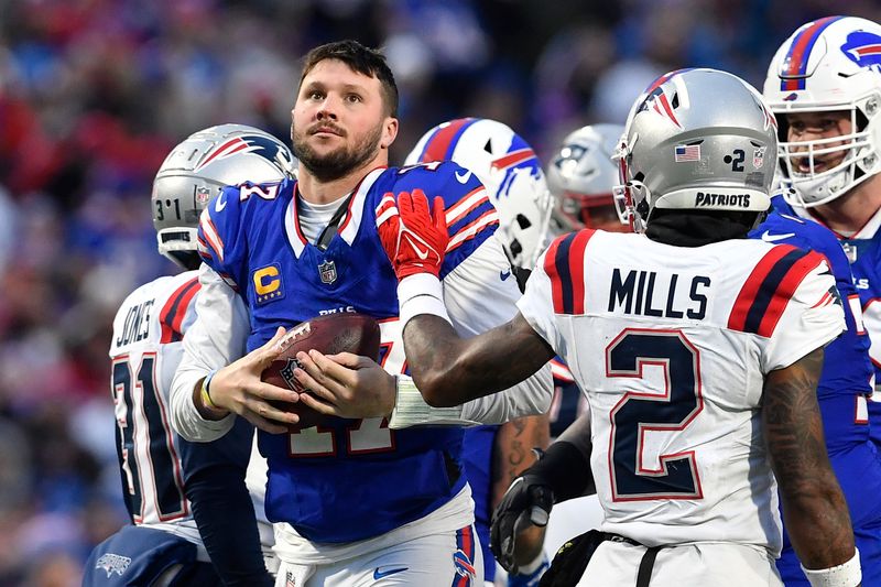 Buffalo Bills quarterback Josh Allen (17) looks at the scoreboard as time runs out during the second half of an NFL football game against the New England Patriots in Orchard Park, N.Y., Sunday, Dec. 31, 2023. (AP Photo/Adrian Kraus)