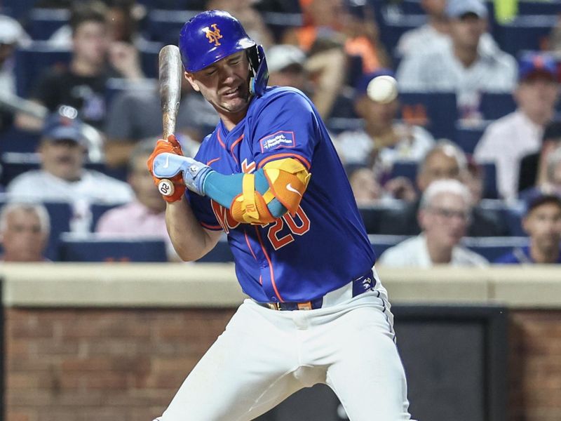 Jun 26, 2024; New York City, New York, USA;  New York Mets first baseman Pete Alonso (20) leans back to avoid getting hit by the pitch in the fifth inning against the New York Yankees at Citi Field. Mandatory Credit: Wendell Cruz-USA TODAY Sports