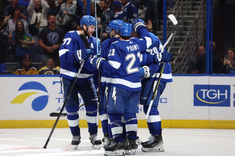 Nov 20, 2023; Tampa, Florida, USA; Tampa Bay Lightning center Steven Stamkos (91) celebrates with defenseman Victor Hedman (77), center Brayden Point (21), left wing Nicholas Paul (20) and  right wing Nikita Kucherov (86) after he scores a goal against the Boston Bruins during the third period at Amalie Arena. Mandatory Credit: Kim Klement Neitzel-USA TODAY Sports