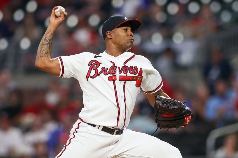 Sep 7, 2023; Atlanta, Georgia, USA; Atlanta Braves relief pitcher Raisel Iglesias (26) throws against the St. Louis Cardinals in the ninth inning at Truist Park. Mandatory Credit: Brett Davis-USA TODAY Sports
