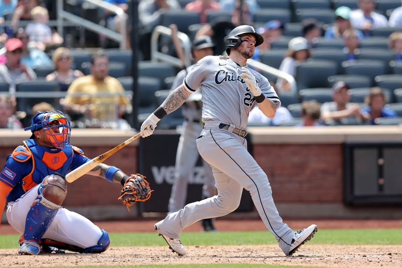 Jul 20, 2023; New York City, New York, USA; Chicago White Sox catcher Yasmani Grandal (24) follows through on a two run double against the New York Mets during the sixth inning at Citi Field. Mandatory Credit: Brad Penner-USA TODAY Sports