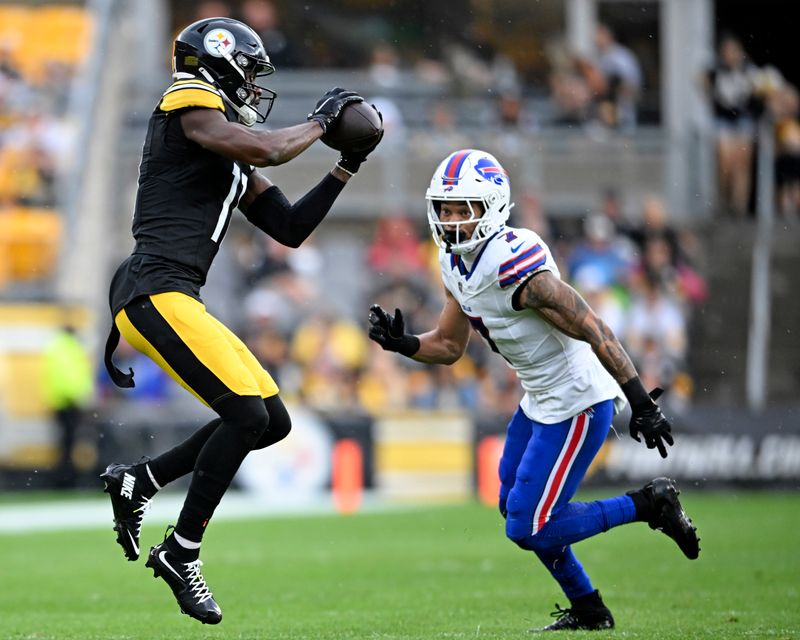 Pittsburgh Steelers wide receiver Van Jefferson, left, catches a pass with Buffalo Bills cornerback Taron Johnson (7) defending during the first half of a preseason NFL football game, Saturday, Aug. 17, 2024, in Pittsburgh. (AP Photo/Matt Freed)