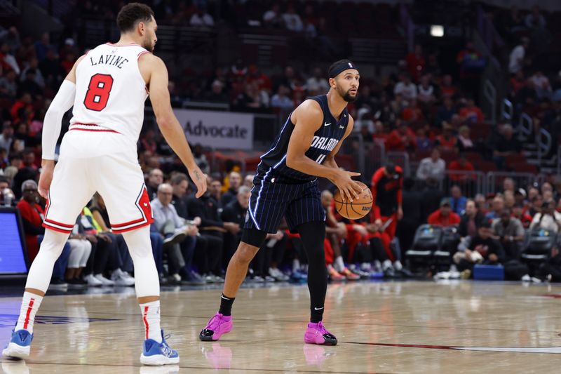 CHICAGO, IL - OCTOBER 30: Jalen Suggs #4 of the Orlando Magic looks to pass the ball during the game against the Chicago Bulls on October 30, 2024 at United Center in Chicago, Illinois. NOTE TO USER: User expressly acknowledges and agrees that, by downloading and or using this photograph, User is consenting to the terms and conditions of the Getty Images License Agreement. Mandatory Copyright Notice: Copyright 2024 NBAE (Photo by Kamil Krzaczynski/NBAE via Getty Images)