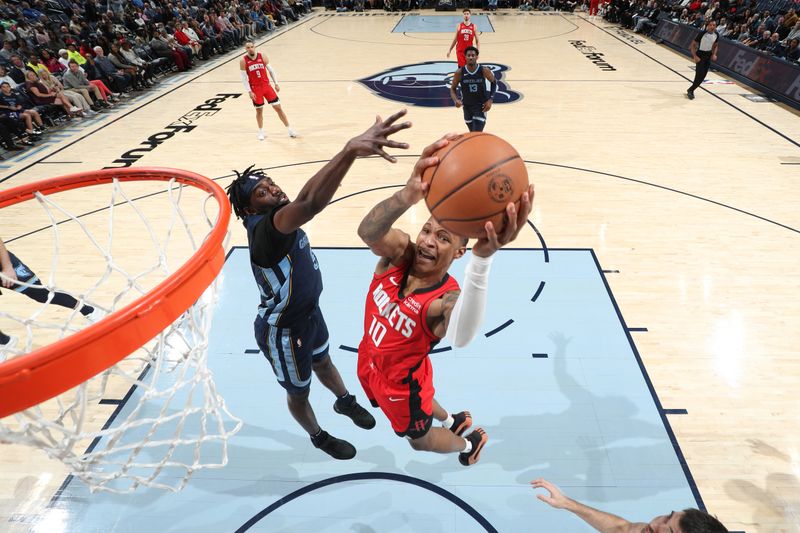 MEMPHIS, TN - FEBRUARY 14: Jabari Smith Jr. #10 of the Houston Rockets drives to the basket during the game against the Memphis Grizzlies on February 14, 2024 at FedExForum in Memphis, Tennessee. NOTE TO USER: User expressly acknowledges and agrees that, by downloading and or using this photograph, User is consenting to the terms and conditions of the Getty Images License Agreement. Mandatory Copyright Notice: Copyright 2024 NBAE (Photo by Joe Murphy/NBAE via Getty Images)