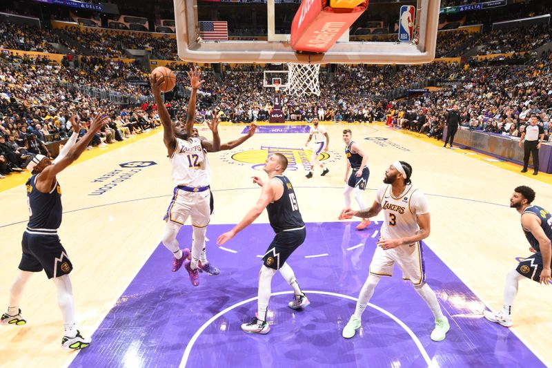 LOS ANGELES, CA - APRIL 27: Taurean Prince #12 of the Los Angeles Lakers drives to the basket during the game against the Denver Nuggets during Round 1 Game 4 of the 2024 NBA Playoffs on April 27, 2024 at Crypto.Com Arena in Los Angeles, California. NOTE TO USER: User expressly acknowledges and agrees that, by downloading and/or using this Photograph, user is consenting to the terms and conditions of the Getty Images License Agreement. Mandatory Copyright Notice: Copyright 2024 NBAE (Photo by Andrew D. Bernstein/NBAE via Getty Images)