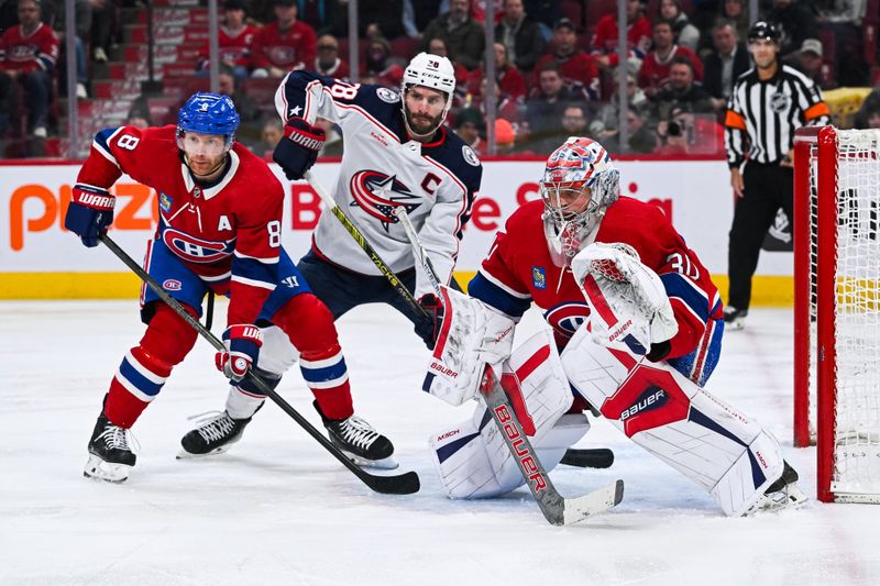 Mar 12, 2024; Montreal, Quebec, CAN; Montreal Canadiens goalie Cayden Primeau (30) tracks the play beside defenseman Mike Matheson (8) and Columbus Blue Jackets center Boone Jenner (38) during the second period at Bell Centre. Mandatory Credit: David Kirouac-USA TODAY Sports