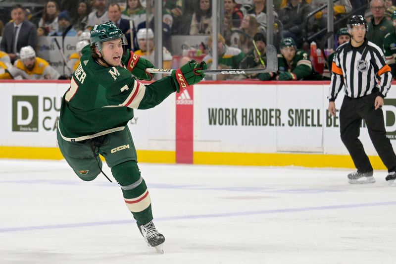 Jan 25, 2024; Saint Paul, Minnesota, USA; Minnesota Wild defenseman Brock Faber (7) takes a shot on goal against the Nashville Predators during the second period at Xcel Energy Center. Mandatory Credit: Nick Wosika-USA TODAY Sports