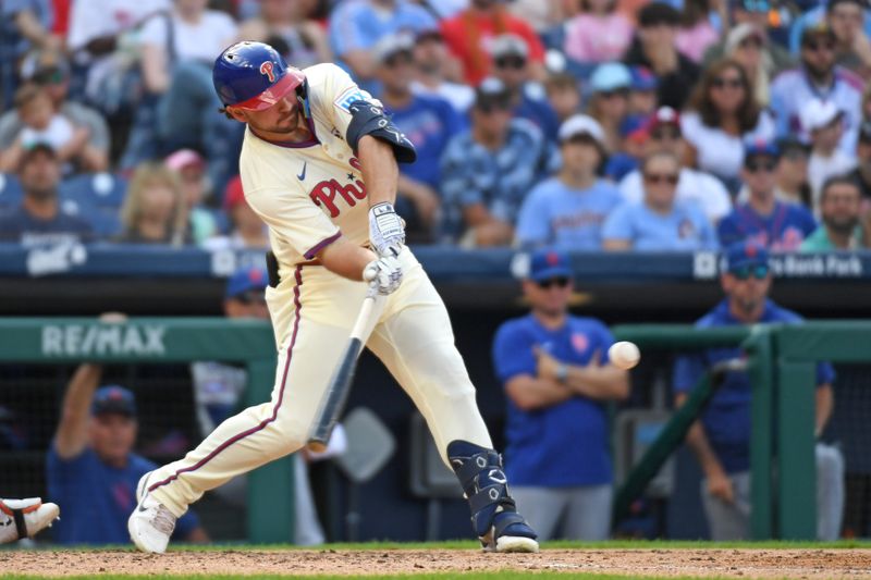 Sep 15, 2024; Philadelphia, Pennsylvania, USA; Philadelphia Phillies second base Buddy Kennedy (19) hits and RBI double during the eighth inning against the New York Mets at Citizens Bank Park. Mandatory Credit: Eric Hartline-Imagn Images