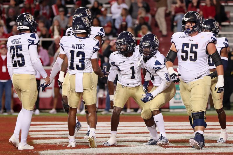 Nov 18, 2023; Fayetteville, Arkansas, USA; FIU Panthers quarterback Keyone Jenkins (1) celebrates after scoring a touchdown in the first quarter against the Arkansas Razorbacks at Donald W. Reynolds Razorback Stadium. Mandatory Credit: Nelson Chenault-USA TODAY Sports