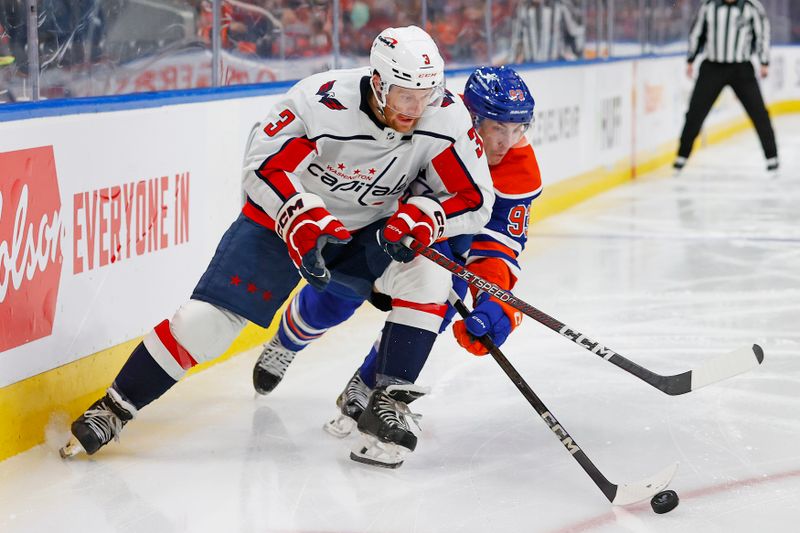 Mar 13, 2024; Edmonton, Alberta, CAN; Washington Capitals defensemen Nick Jensen (3) and Edmonton Oilers forward Ryan Nugent-Hopkins (93) battle for a loose puck during the second period at Rogers Place. Mandatory Credit: Perry Nelson-USA TODAY Sports