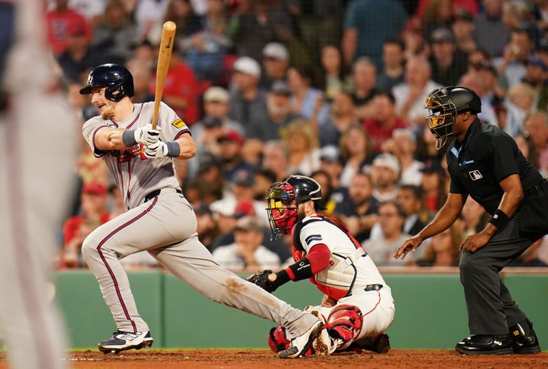 Jun 4, 2024; Boston, Massachusetts, USA; Atlanta Braves catcher Sean Murphy (12) singles to left field to driven a run against the Boston Red Sox in the fourth inning at Fenway Park. Mandatory Credit: David Butler II-USA TODAY Sports