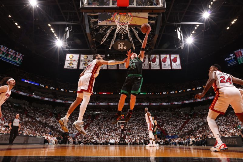 MIAMI, FL - APRIL 27: Payton Pritchard #11 of the Boston Celtics shoots the ball during the game against the Miami Heat during Round 1 Game 3 of the 2024 NBA Playoffs on April 27, 2024 at Kaseya Center in Miami, Florida. NOTE TO USER: User expressly acknowledges and agrees that, by downloading and or using this Photograph, user is consenting to the terms and conditions of the Getty Images License Agreement. Mandatory Copyright Notice: Copyright 2024 NBAE (Photo by Issac Baldizon/NBAE via Getty Images)