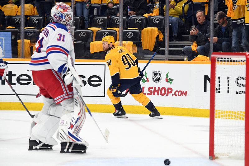 Dec 2, 2023; Nashville, Tennessee, USA; Nashville Predators center Ryan O'Reilly (90) celebrates after a goal against New York Rangers goaltender Igor Shesterkin (31) during the first period at Bridgestone Arena. Mandatory Credit: Christopher Hanewinckel-USA TODAY Sports