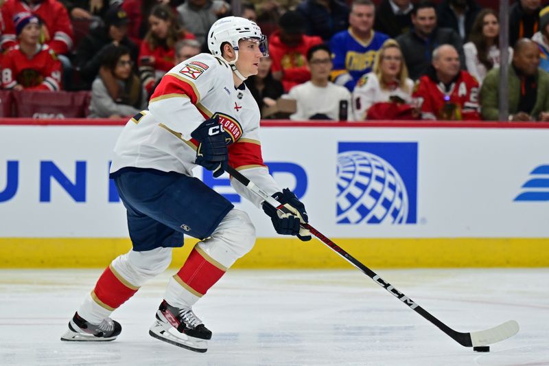 Nov 21, 2024; Chicago, Illinois, USA; Florida Panthers defenseman Gustav Forsling (42) skates with the puck against the Chicago Blackhawks during the second period at the United Center. Mandatory Credit: Daniel Bartel-Imagn Images