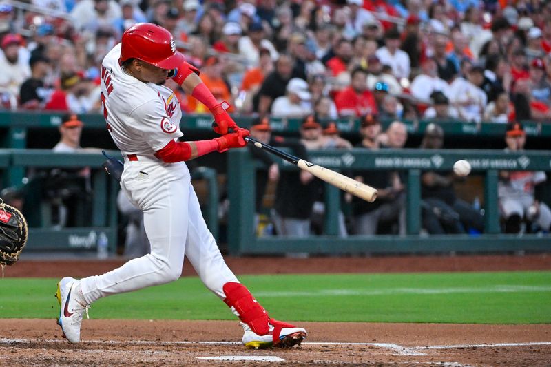 May 20, 2024; St. Louis, Missouri, USA;  St. Louis Cardinals shortstop Masyn Winn (0) hits a one run double against the Baltimore Orioles during the fourth inning at Busch Stadium. Mandatory Credit: Jeff Curry-USA TODAY Sports