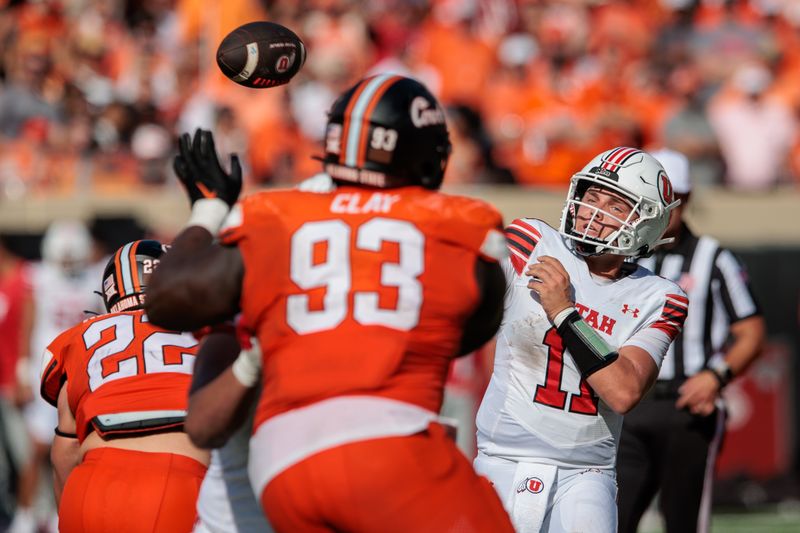 Sep 21, 2024; Stillwater, Oklahoma, USA; Utah Utes quarterback Isaac Wilson (11) passes during the second quarter against the Oklahoma State Cowboys at Boone Pickens Stadium. Mandatory Credit: William Purnell-Imagn Images