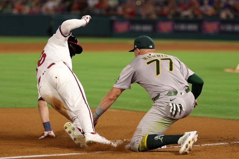 Jul 25, 2024; Anaheim, California, USA;  Los Angeles Angels center fielder Mickey Moniak (16) is out at third base as Oakland Athletics third baseman Brett Harris (77) applies the tag during the seventh inning against the Oakland Athletics at Angel Stadium. Mandatory Credit: Kiyoshi Mio-USA TODAY Sports