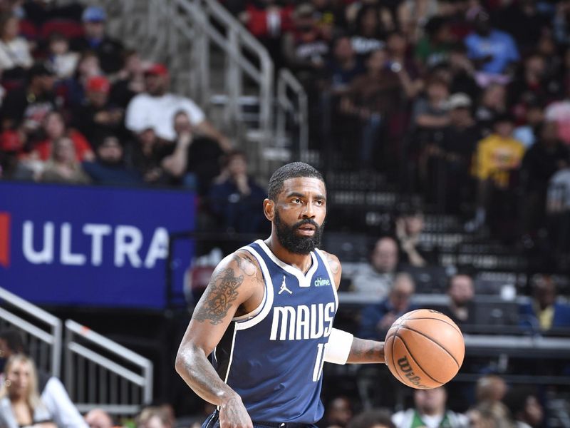 HOUSTON, TX - MARCH 31: Kyrie Irving #11 of the Dallas Mavericks handles the ball during the game against the Houston Rockets on March 31, 2024 at the Toyota Center in Houston, Texas. NOTE TO USER: User expressly acknowledges and agrees that, by downloading and or using this photograph, User is consenting to the terms and conditions of the Getty Images License Agreement. Mandatory Copyright Notice: Copyright 2024 NBAE (Photo by Logan Riely/NBAE via Getty Images)