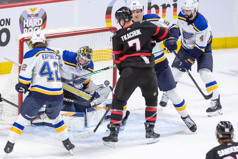 Mar 21, 2024; Ottawa, Ontario, CAN; St. Louis Blues goalie Joel Hofer (30) makes a save in front of Ottawa Senators left wing Brady Tkachuk (7) in the third period at the Canadian Tire Centre. Mandatory Credit: Marc DesRosiers-USA TODAY Sports