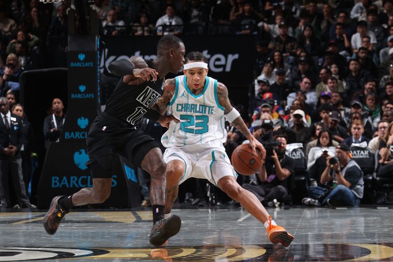 BROOKLYN, NY - NOVEMBER 19: Tre Mann #23 of the Charlotte Hornets handles the ball during the game against the Brooklyn Nets during an Emirates NBA Cup game on November 19, 2024 at Barclays Center in Brooklyn, New York. NOTE TO USER: User expressly acknowledges and agrees that, by downloading and or using this Photograph, user is consenting to the terms and conditions of the Getty Images License Agreement. Mandatory Copyright Notice: Copyright 2024 NBAE (Photo by Nathaniel S. Butler/NBAE via Getty Images)