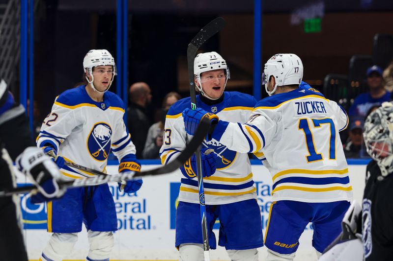 Feb 28, 2026; Tampa, Florida, USA; Buffalo Sabres defenseman Zach Metsa (73) celebrates a goal with forward Jack Quinn (22) and forward Jason Zucker (17) against the Tampa Bay Lightning during the second period at Benchmark International Arena. Mandatory Credit: Morgan Tencza-Imagn Images