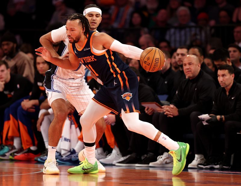 NEW YORK, NEW YORK - DECEMBER 03: Jalen Brunson #11 of the New York Knicks drives against Jalen Suggs #4 of the Orlando Magic during their game at Madison Square Garden on December 03, 2024 in New York City.   User expressly acknowledges and agrees that, by downloading and or using this photograph, User is consenting to the terms and conditions of the Getty Images License Agreement.  (Photo by Al Bello/Getty Images)